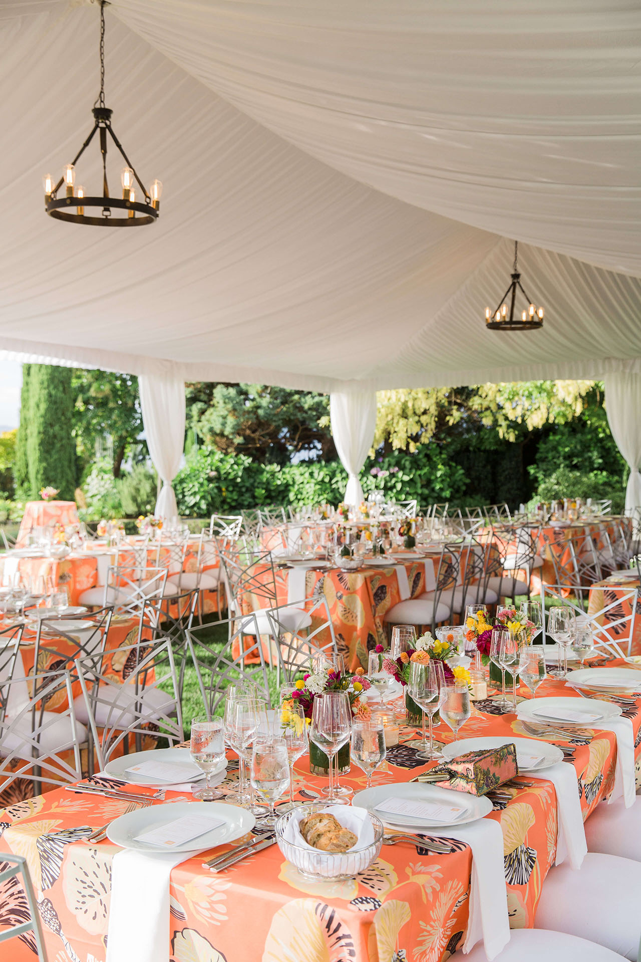 brightly colored table linens to match summer flowers